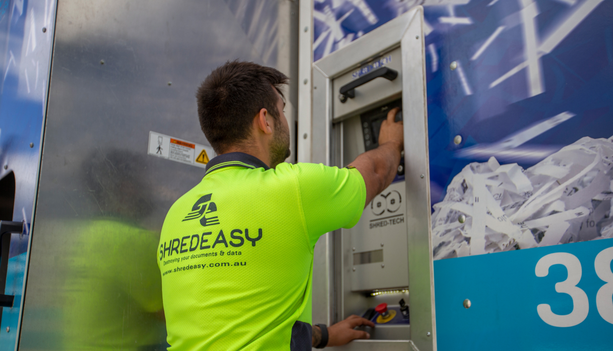 Shred Easy staff operating secure mobile shredding truck